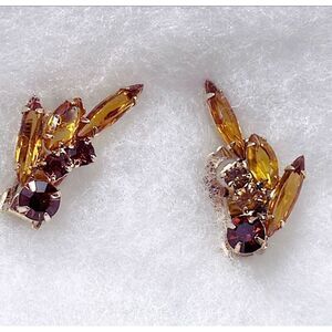 Vintage amber colored glass climber earrings.